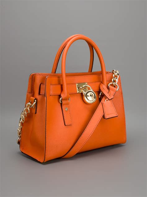 michael kors orange and white purse|burnt orange Michael Kors purse.